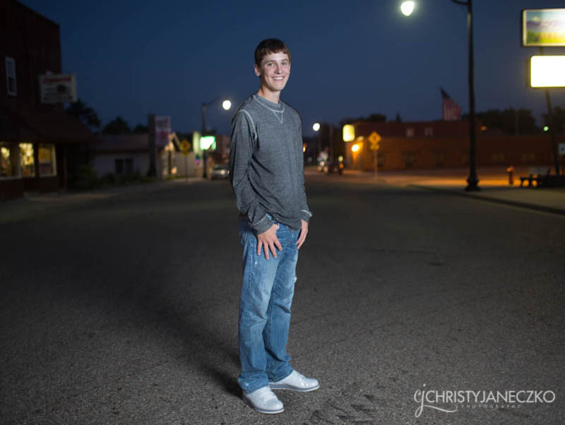 night senior pictures downtown bruce wi