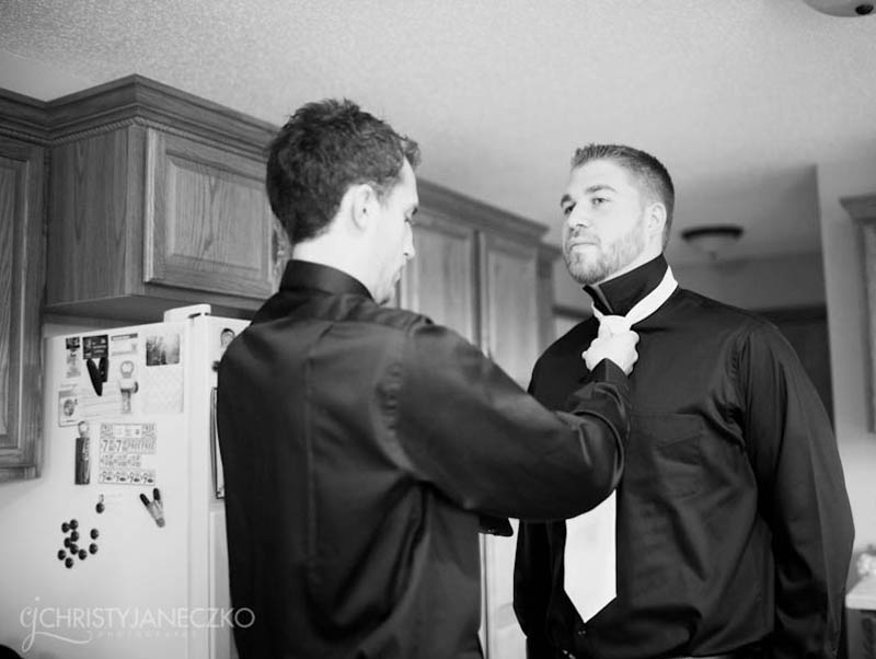 groom and groomsmen getting ready at home