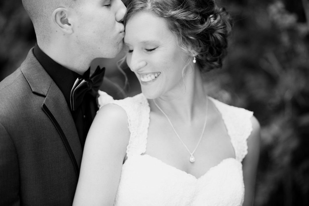groom kissing brides forehead menomonie wi wedding