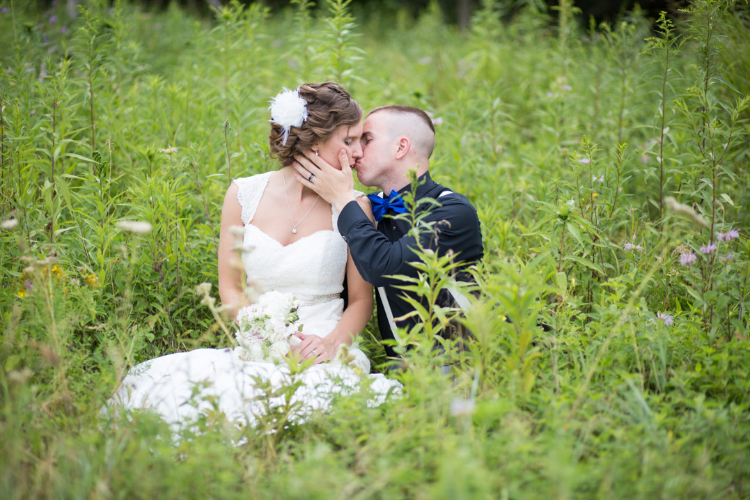 sitting in a field bride and groom menomonie wi wedding