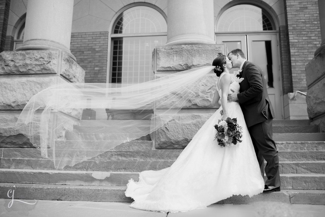 heyde center wedding chippewa falls wi first look cathedral length veil blowing in the wind