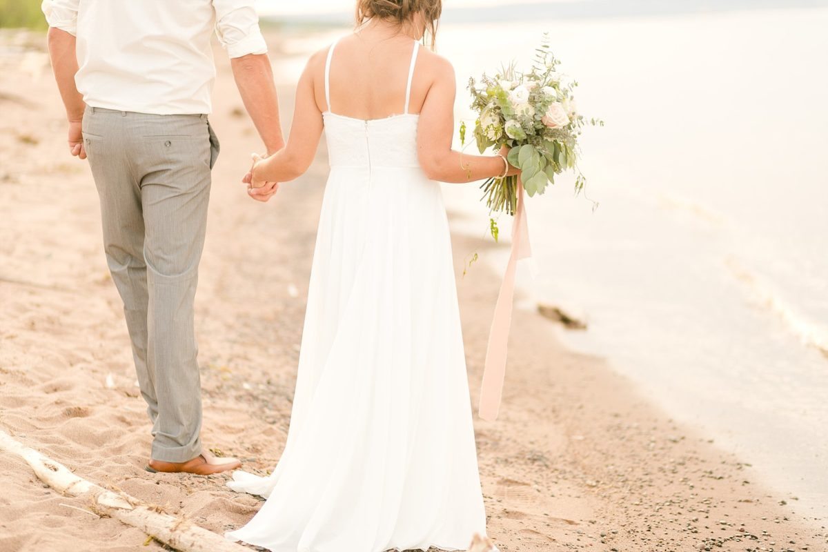 Set on the shores of Lake Superior was an elopement for the ages. Wisconsin Point set just outside of Superior, WI with it's sandy beaches and endless driftwood was the perfect Great Lakes backdrop for these fete. Kitchi Gammi park in Duluth, MN also makes an appearance at this wedding.