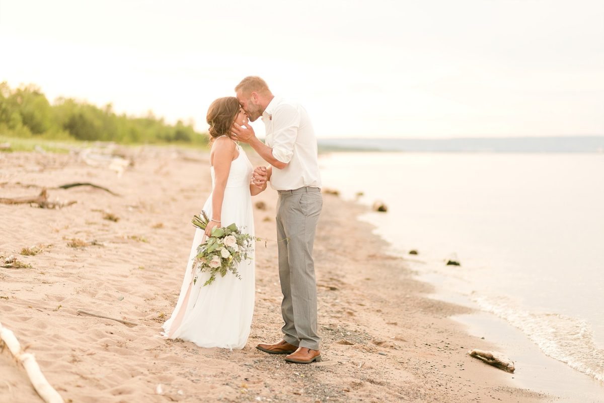 Set on the shores of Lake Superior was an elopement for the ages. Wisconsin Point set just outside of Superior, WI with it's sandy beaches and endless driftwood was the perfect Great Lakes backdrop for these fete. Kitchi Gammi park in Duluth, MN also makes an appearance at this wedding.