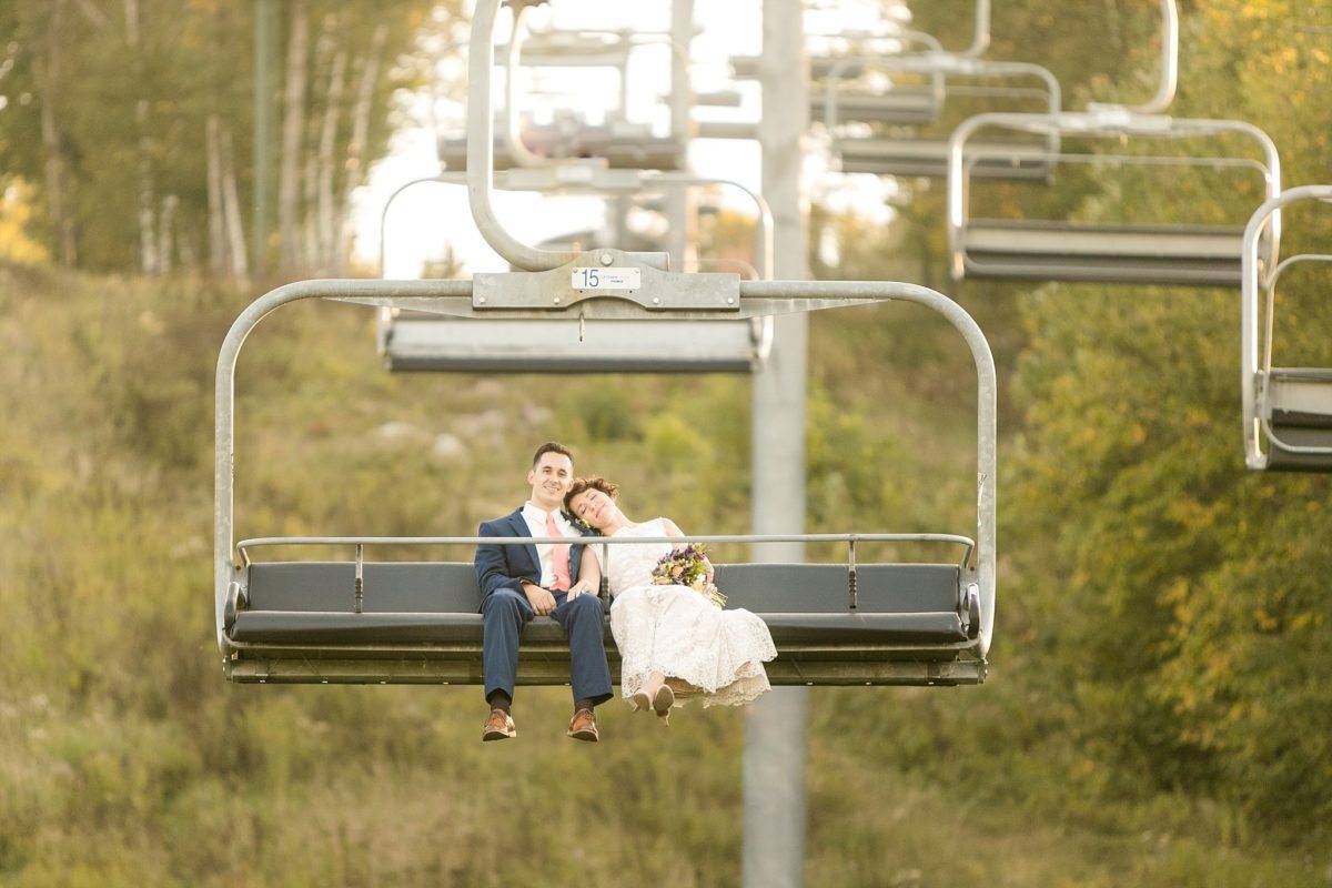 A stunning Wisconsin mountain top wedding, complete with Dodge Challenger and chairlift ride to the sky makes Casey & Taylor's Rib Mountain Amphitheater wedding so perfect.