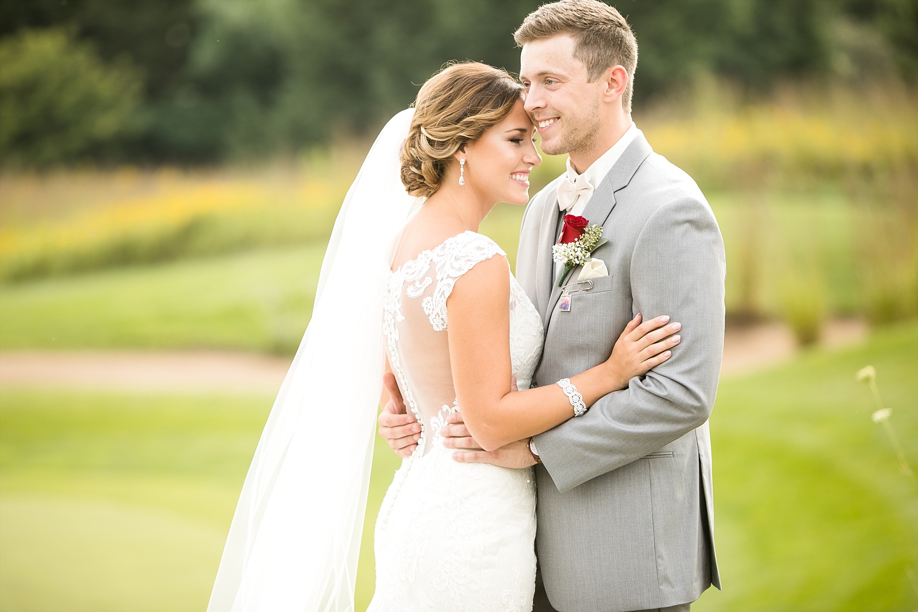 They radiated joy and love for one another as the storm rolled in over their ceremony for an elegant Wild Ridge Golf wedding.