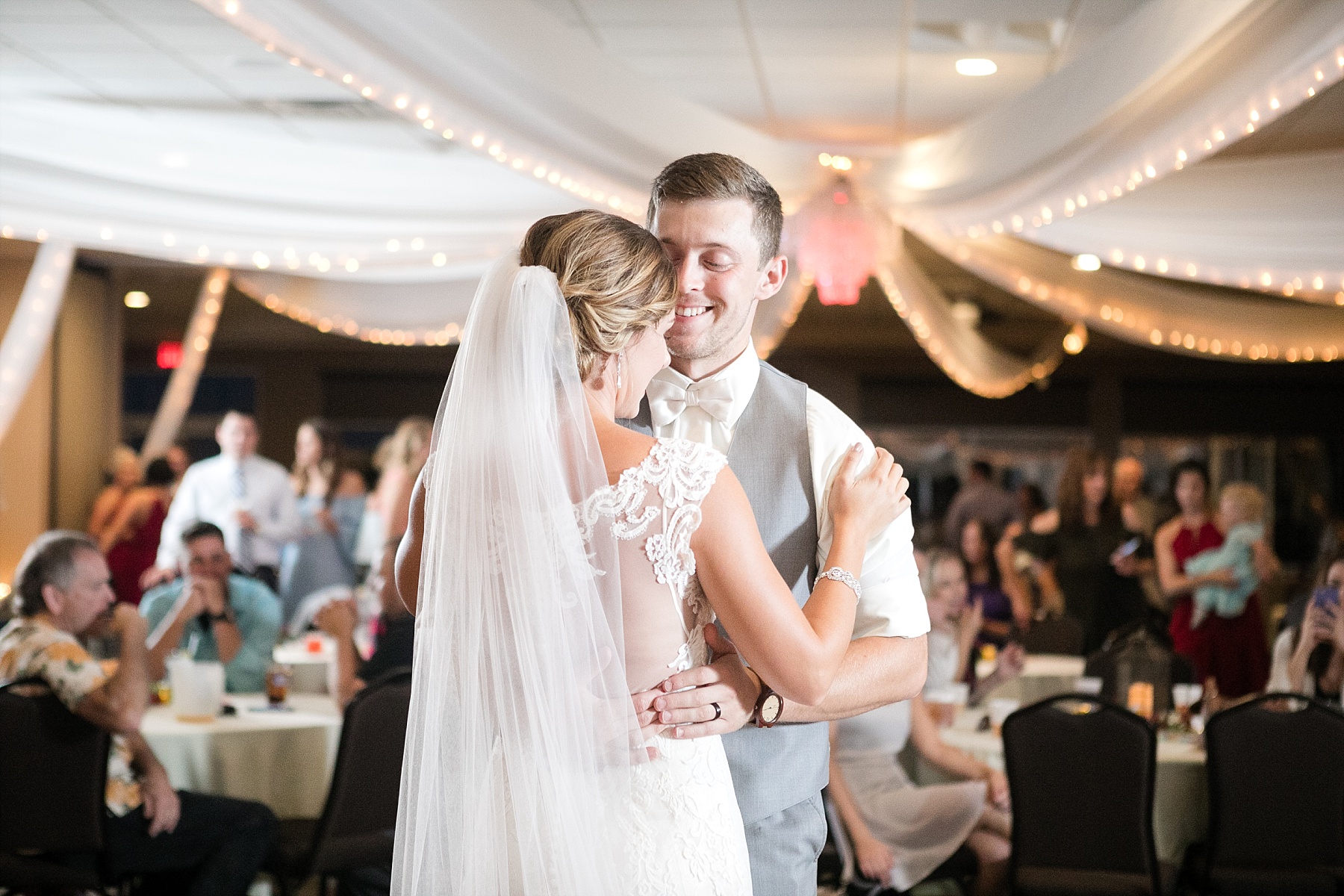 They radiated joy and love for one another as the storm rolled in over their ceremony for an elegant Wild Ridge Golf wedding.