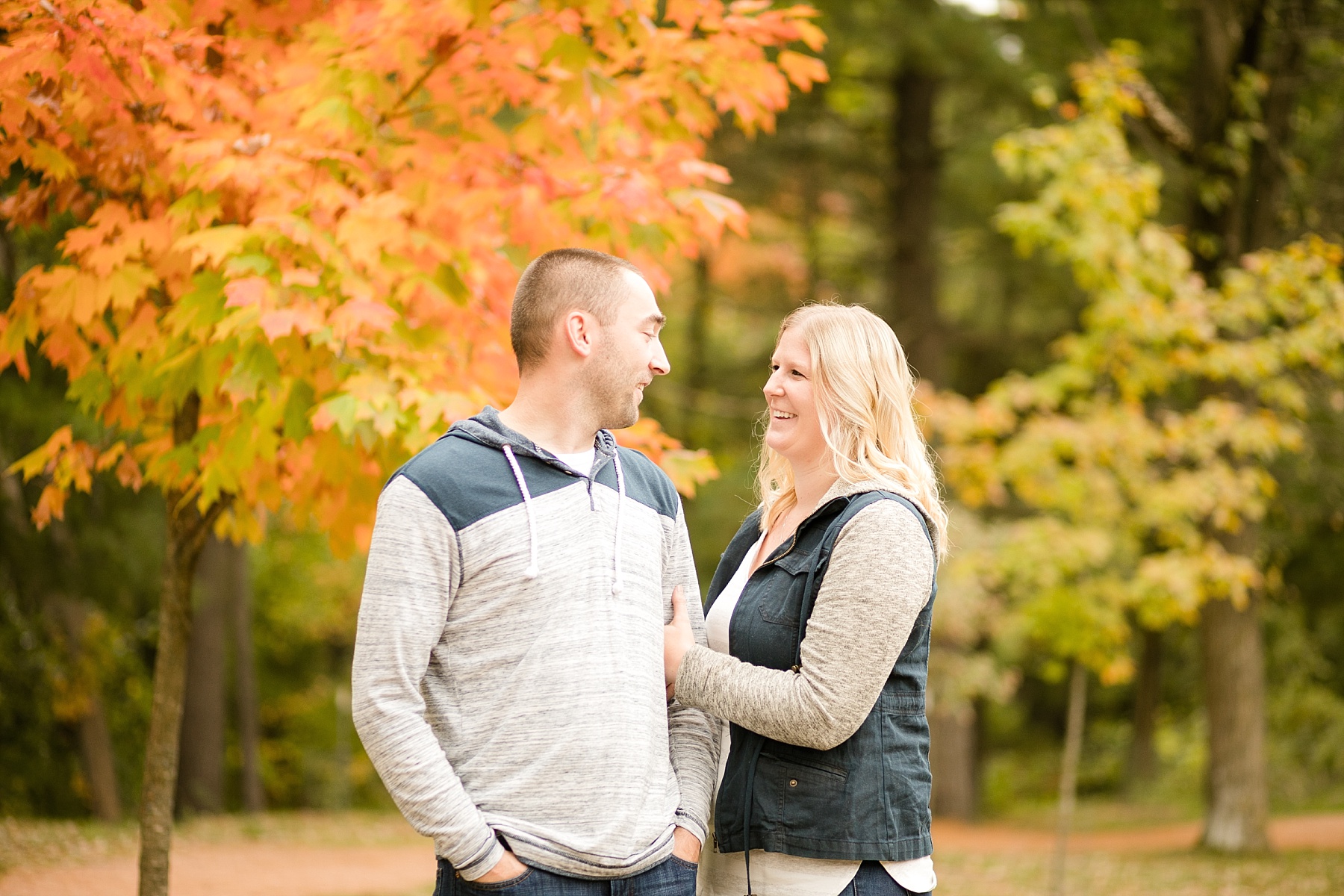 The leaves just starting to turn with vibrant colors, it was a perfect way to ease into fall with Danni & Anthony's fall engagement session in Chippewa Falls.