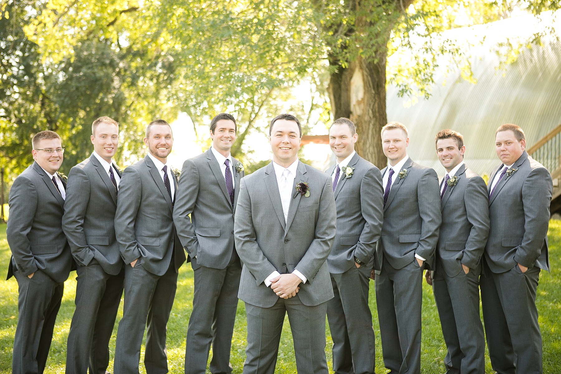 groom and groomsmen pictures outside at Celebrations at the Gables in Turtle Lake, WI