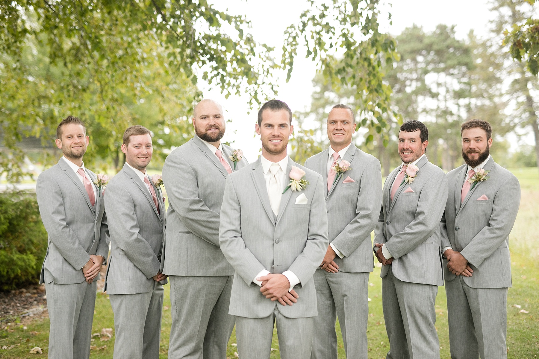groom and groomsmen outside at Lake Wissota Golf & Events