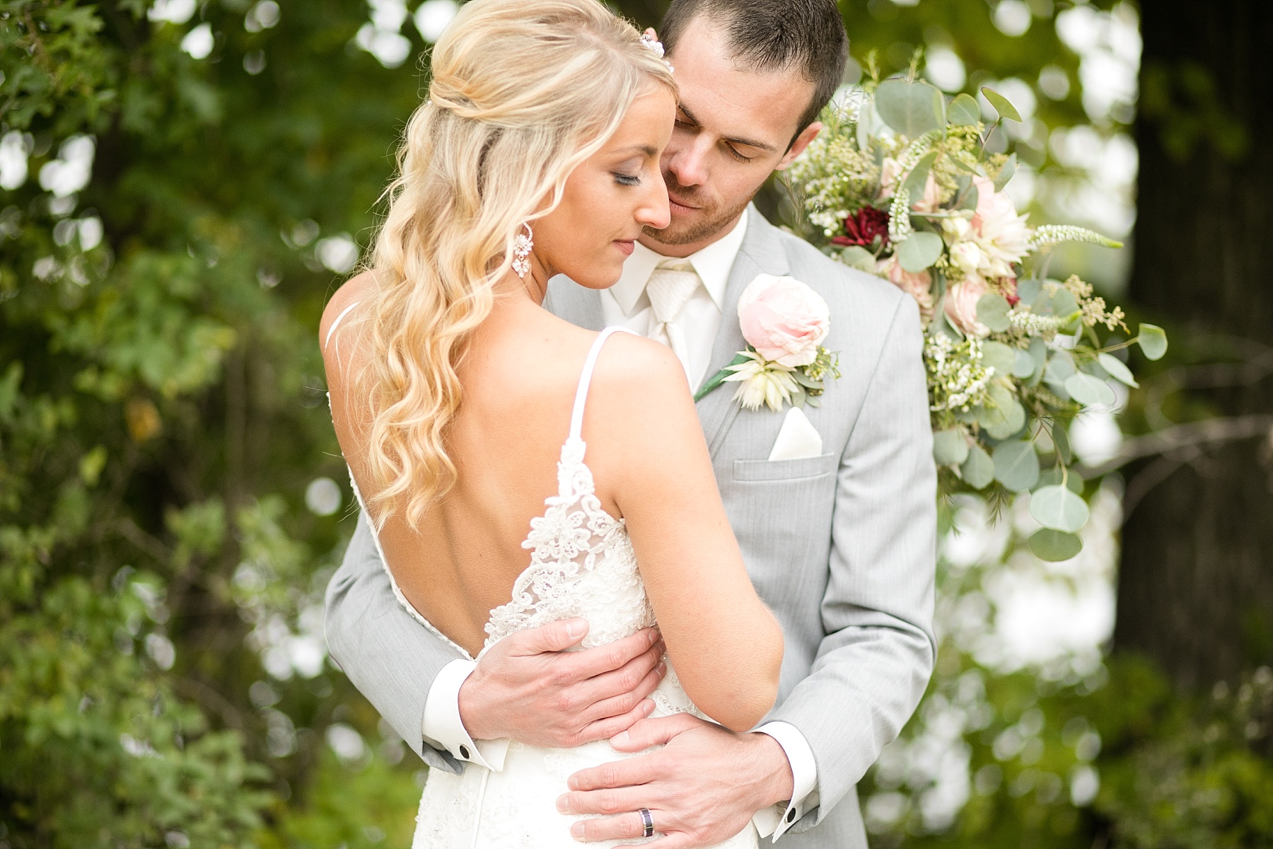 bride and groom close together at Lake Wissota Golf & Events