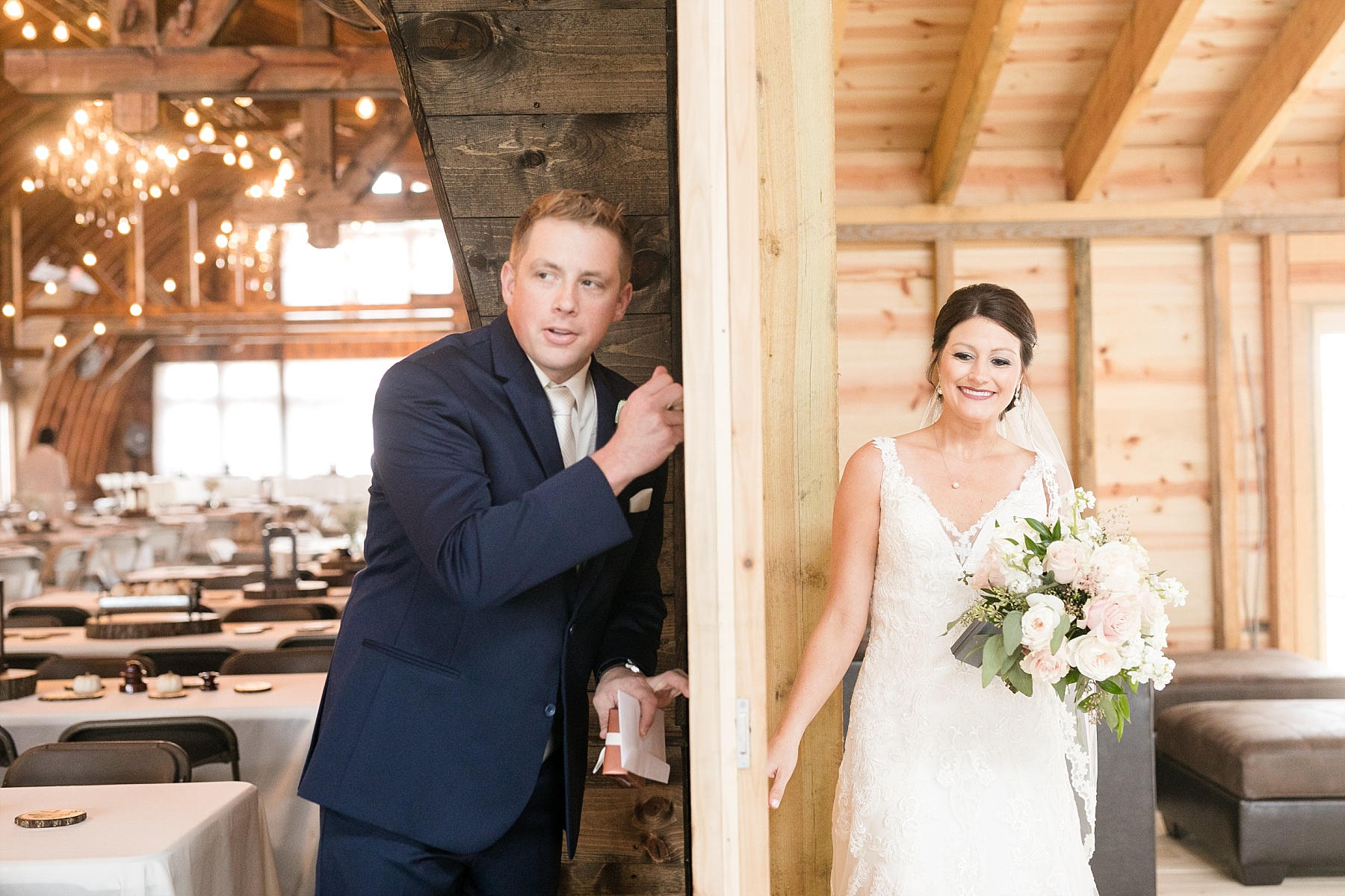 groom and bride first look at the barn on stoney hill