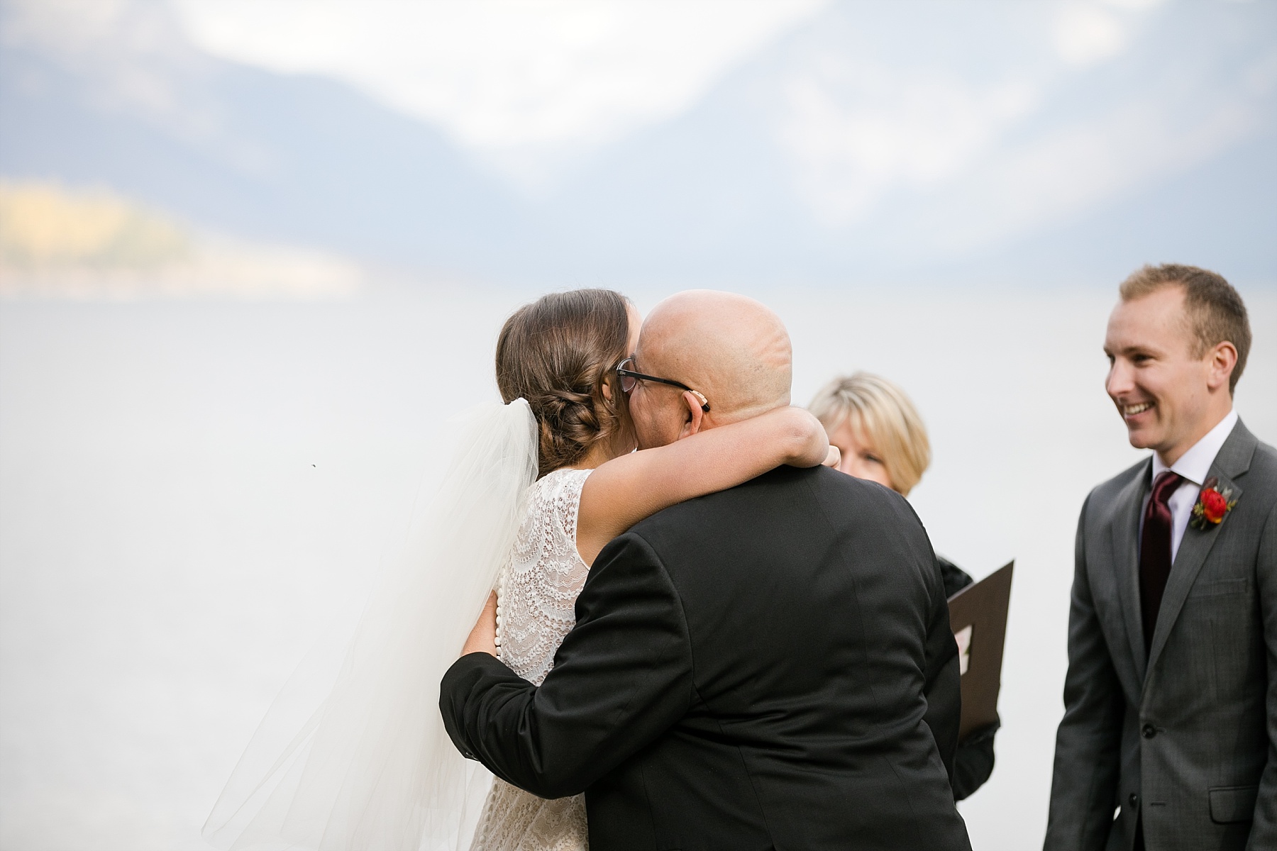 father giving bride away at Glacier National Park elopement