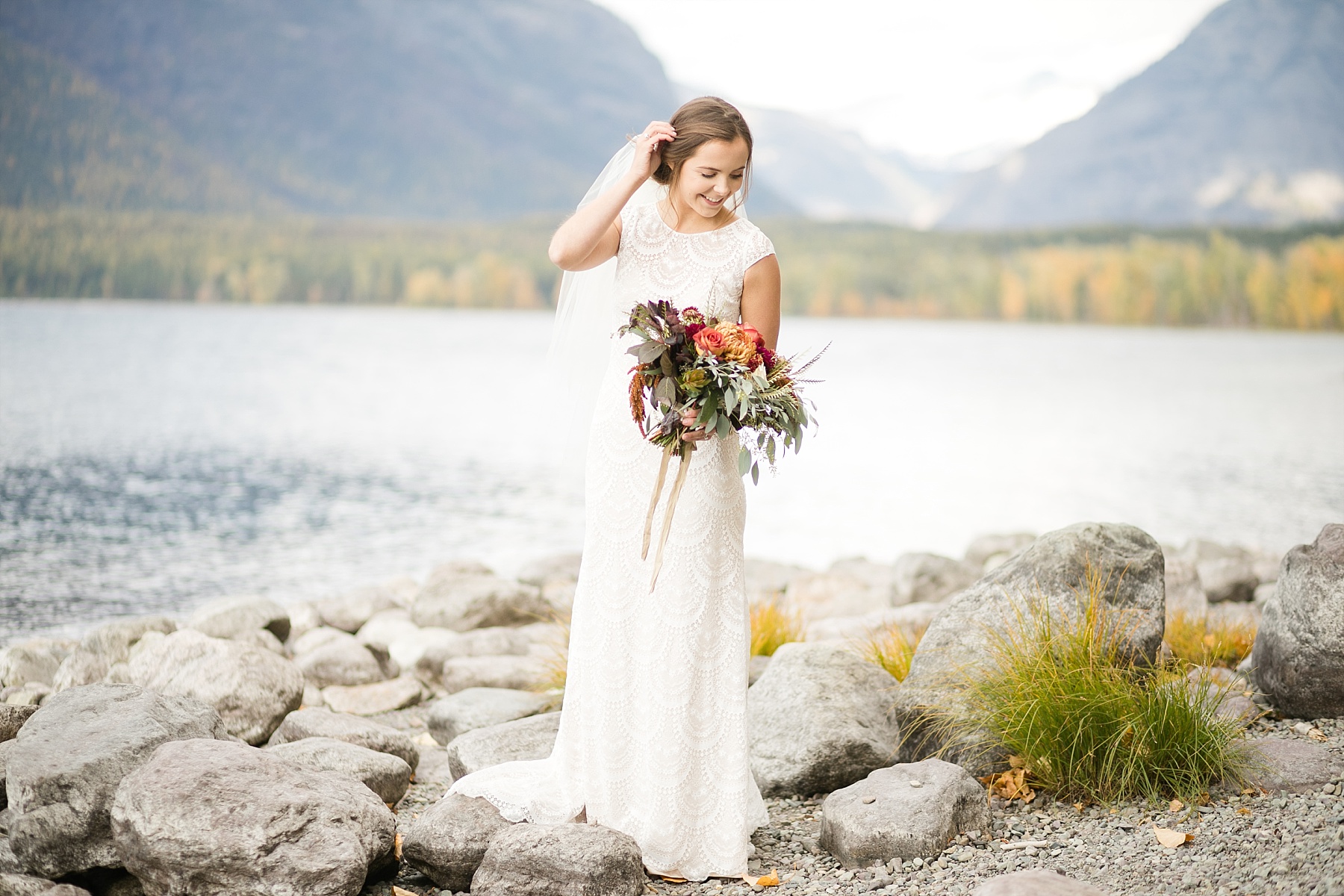 bride looking down on Lake McDonald Glacier National Park