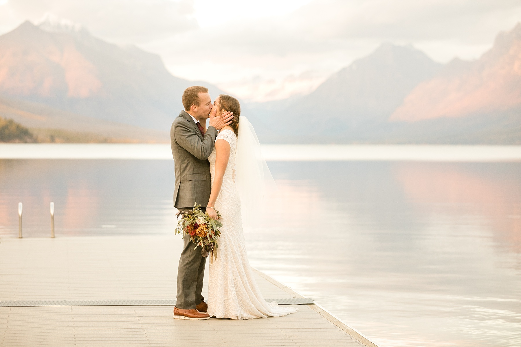 bride and groom on Lake McDonald dock in Apgar