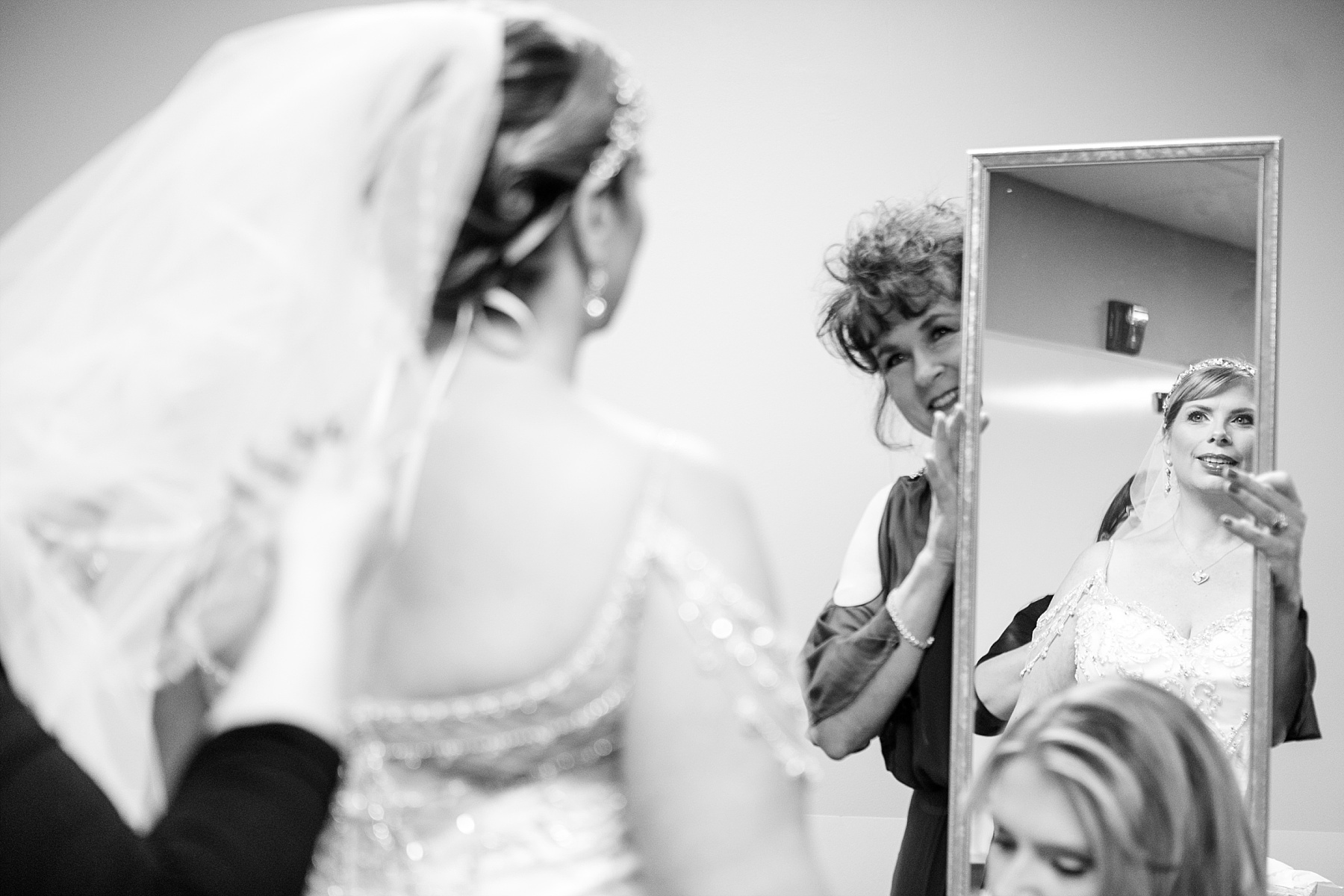 bride seeing herself in the mirror at oak creek assembly of god