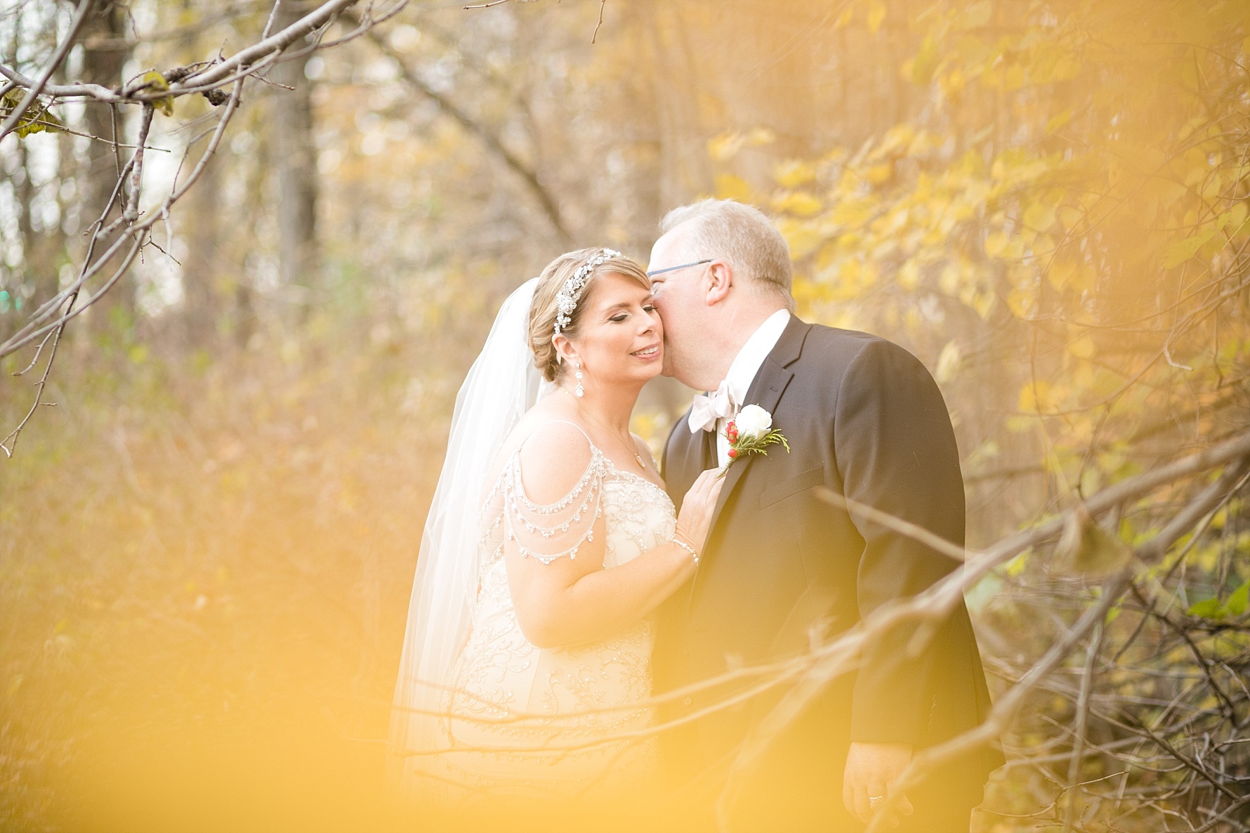 bride and groom in fall colors in milwaukee wi