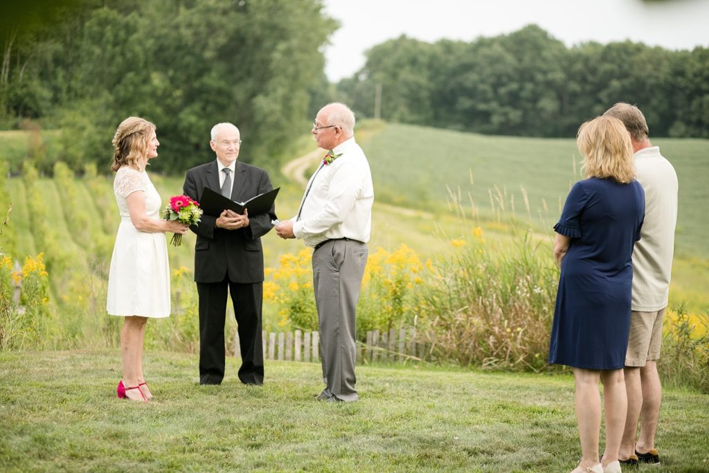 couple with their pastor and witnesses eloping at cottage winery vineyard