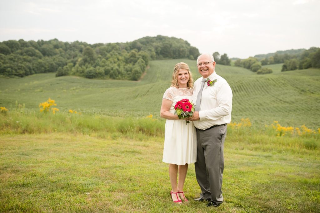 couple overlooking a field at cottage winery in menomonie