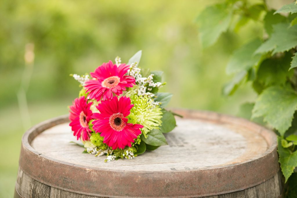 bouquet of brightly colored daisies at an elopement at cottage winery