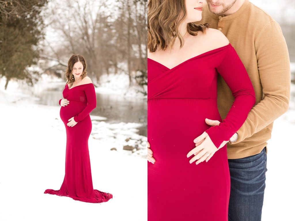 maternity photos near a river in a red dress