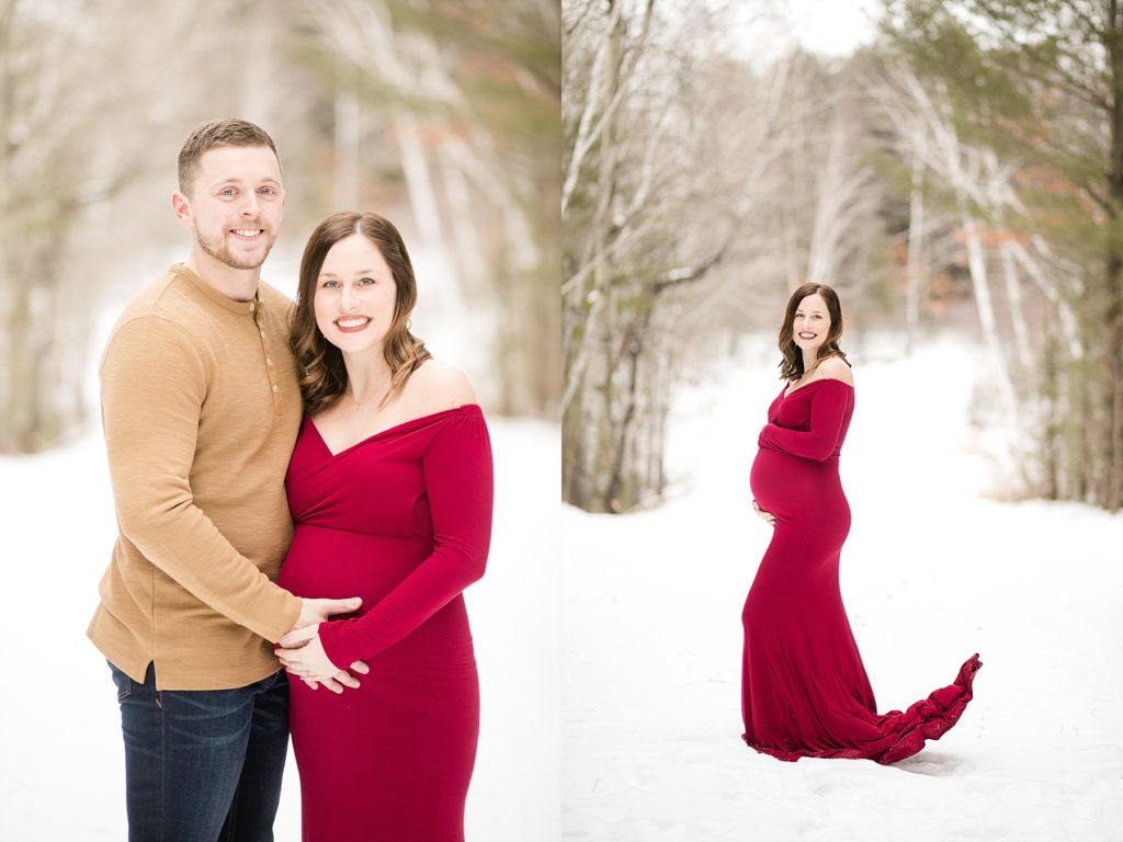 husband and wife smiling at the camera holding her belly in their maternity phtoos