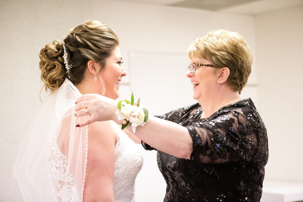 bride and mom getting ready at Wedding at St. Raphael & St. Patrick Cathedral in Dubuque