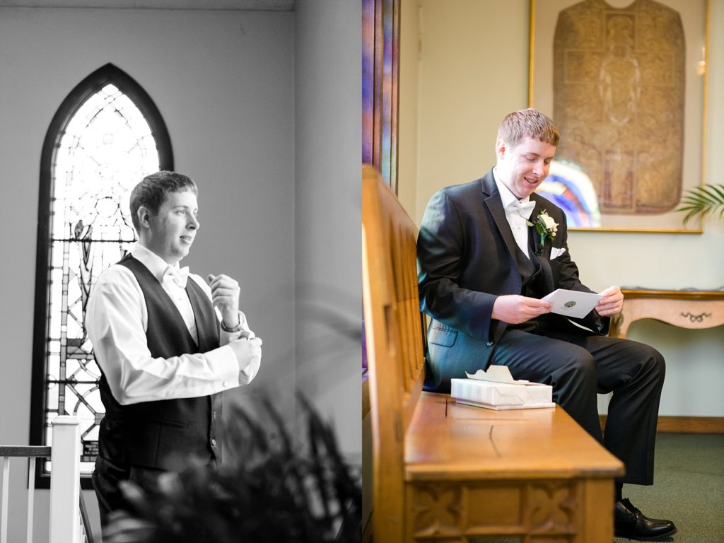 groom getting ready near stained glass windows and reading a letter the bride wrote at Wedding at St. Raphael & St. Patrick Cathedral in Dubuque