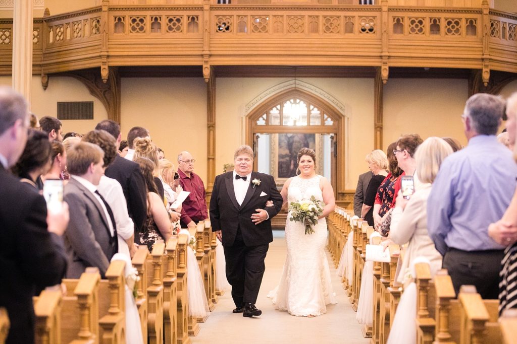 bride and father walking down the aisle at Wedding at St. Raphael & St. Patrick Cathedral in Dubuque