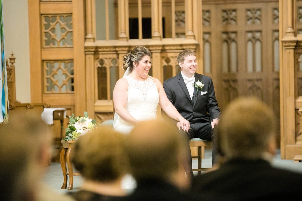 couple during ceremony at Wedding at St. Raphael & St. Patrick Cathedral in Dubuque