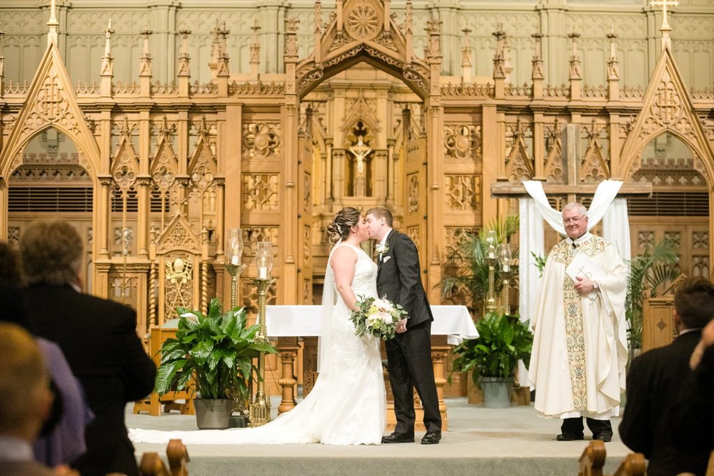 first kiss at St. Raphael's Cathedral Wedding in Dubuque
