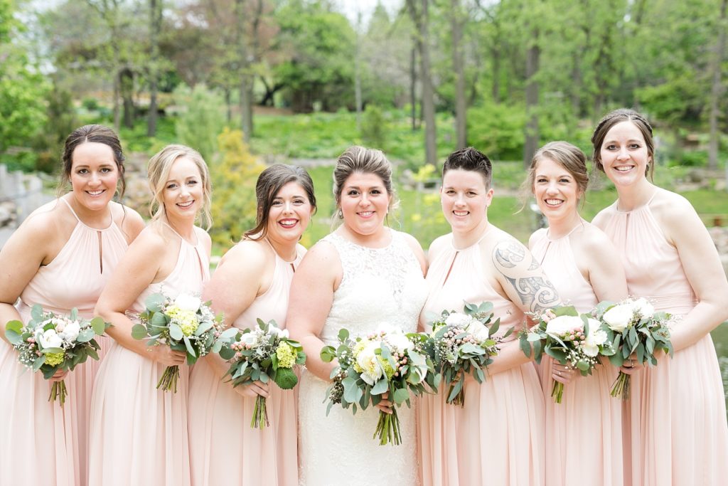 bridesmaids in pink dresses at Dubuque Arboretum