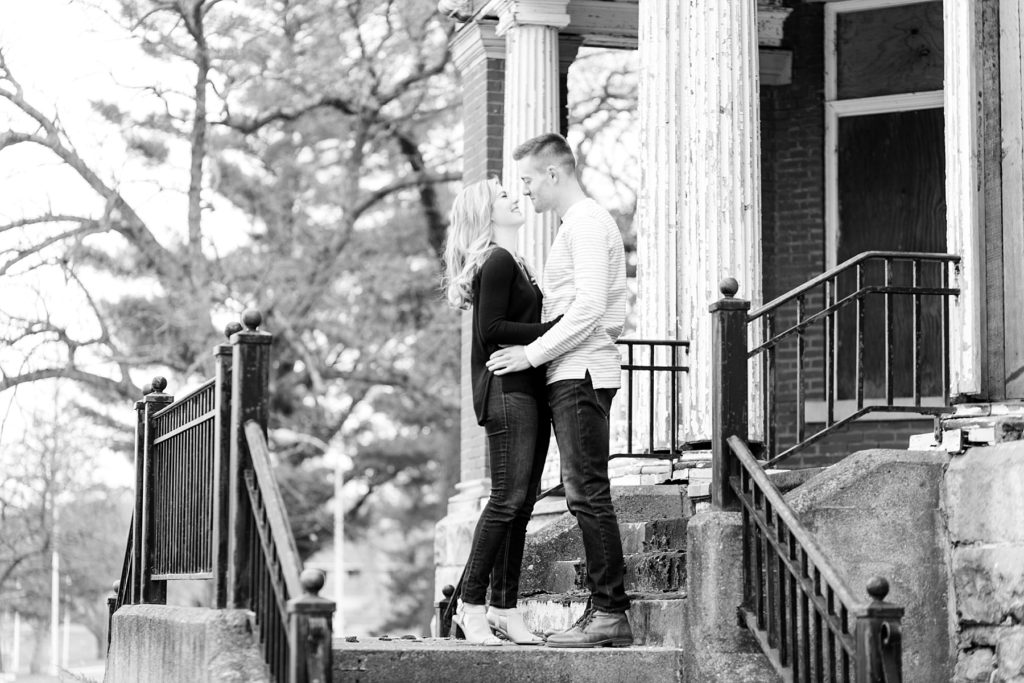 Rachel & AJ standing on the stairs at the Northern Colony in Chippewa Falls