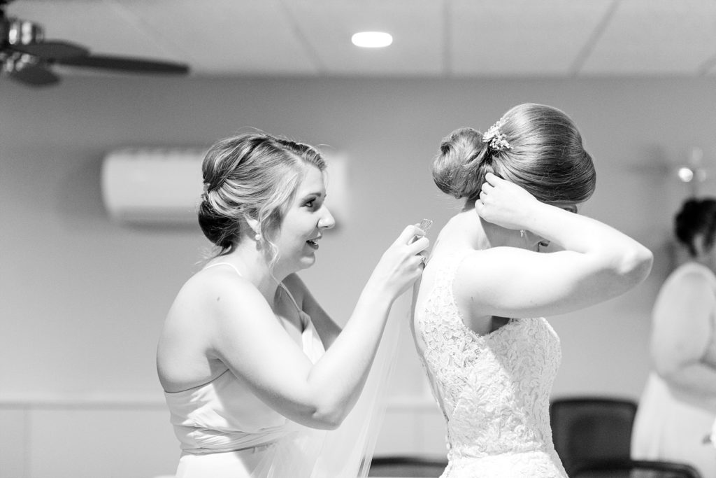 bride getting her veil put in at Hope Lutheran Church in Eau Claire