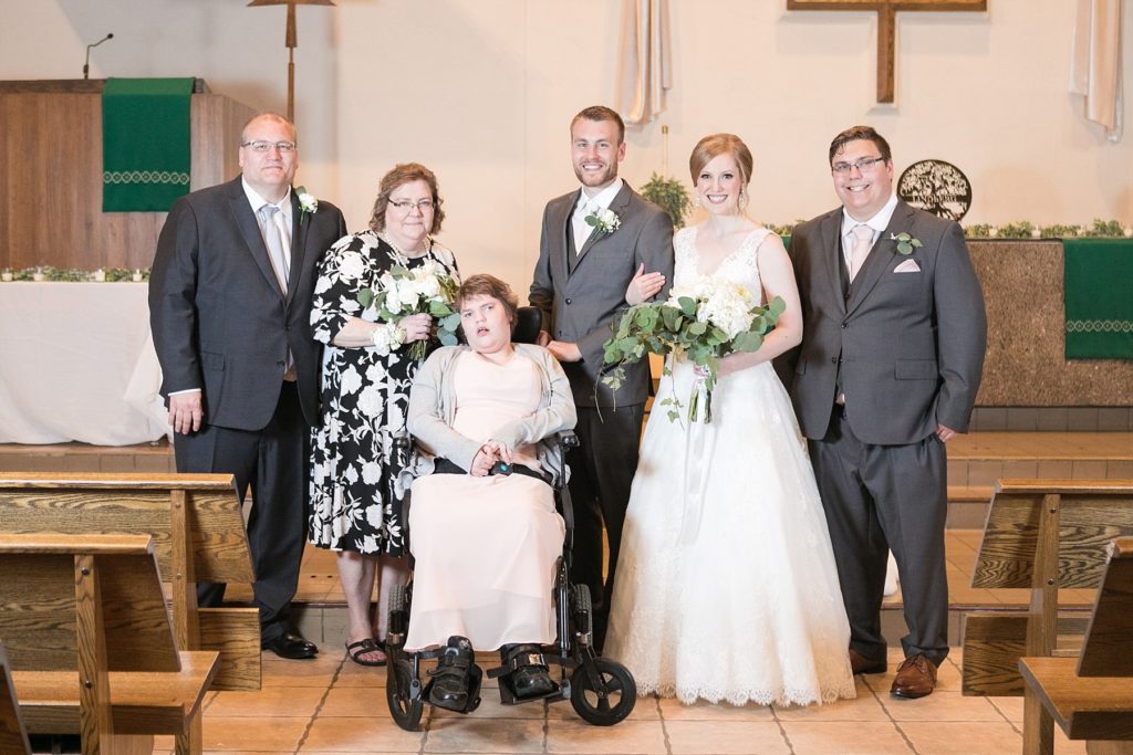 grooms family portrait at Hope Lutheran Church in Eau Claire