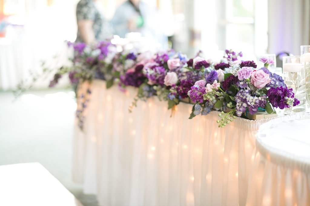 Purple floral arrangements by Allure Premiere Event Florists