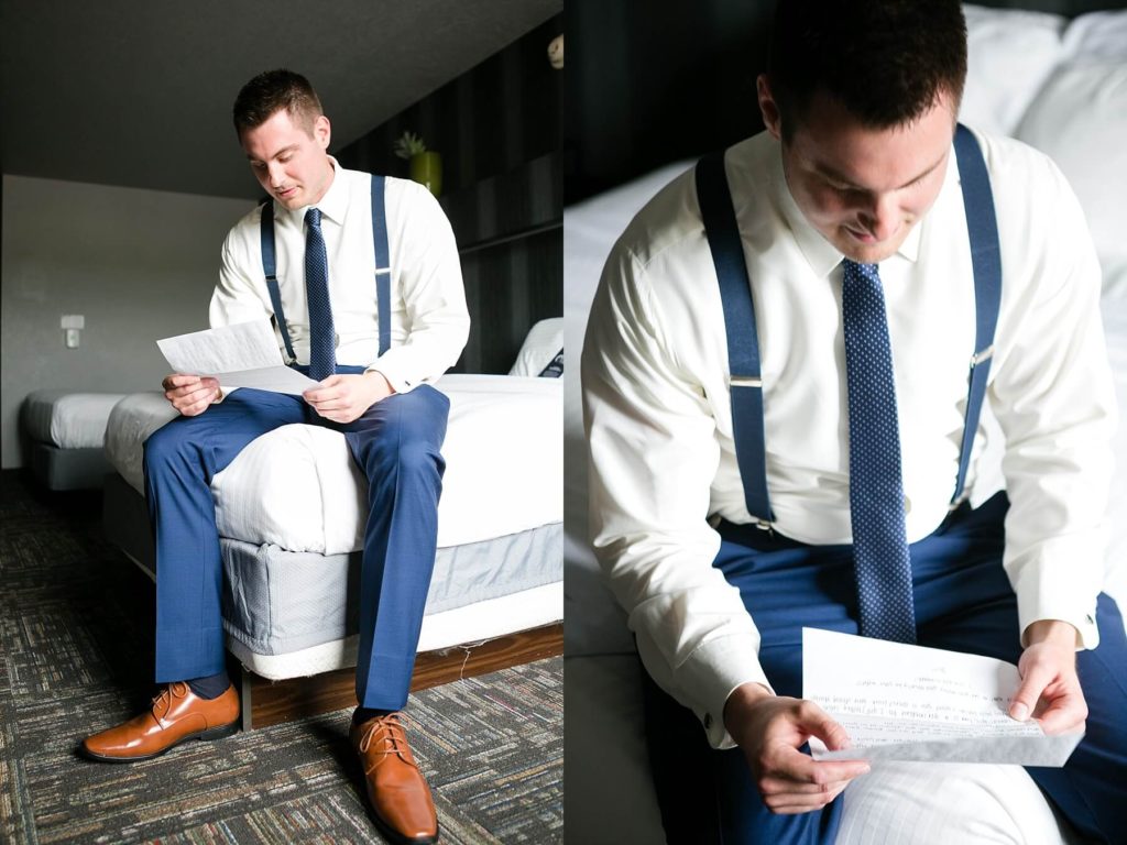 groom reading the letter the bride had written him at The Metropolis Resort in Eau Claire