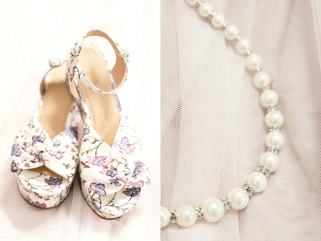 brides shoes and pearl necklace at a Wedding at the Eau Claire Golf & Country Club