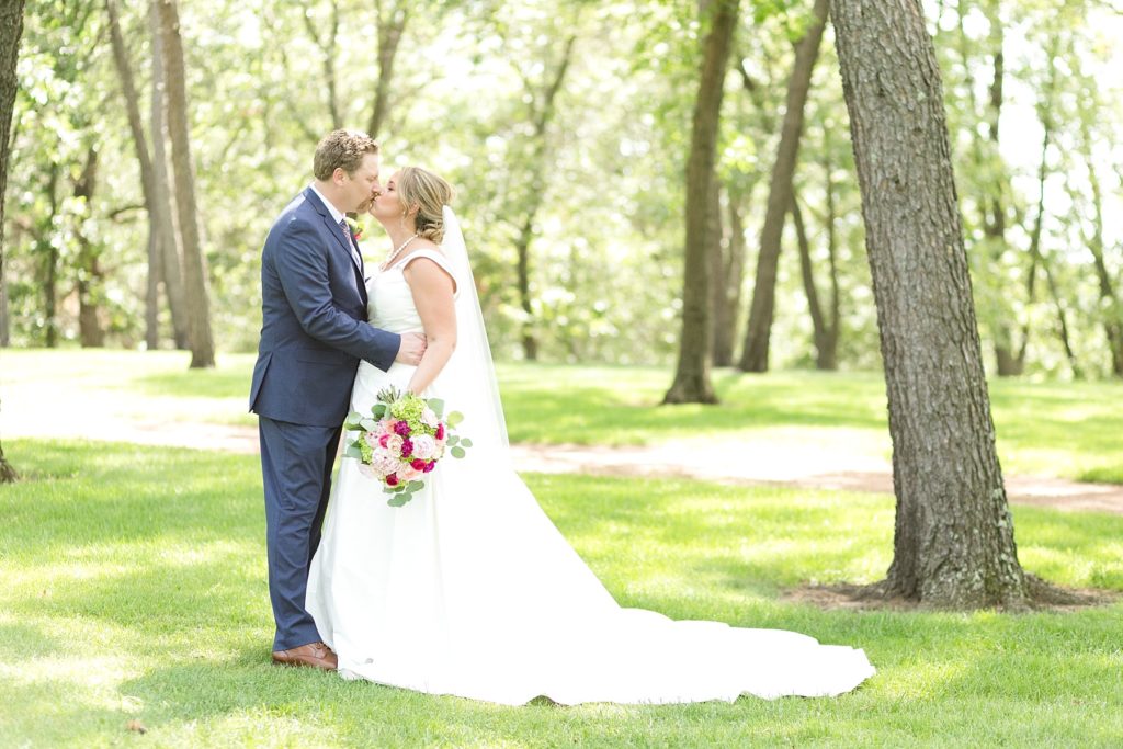 bride and groom portrait kissing at the Eau Claire Golf & Country Club