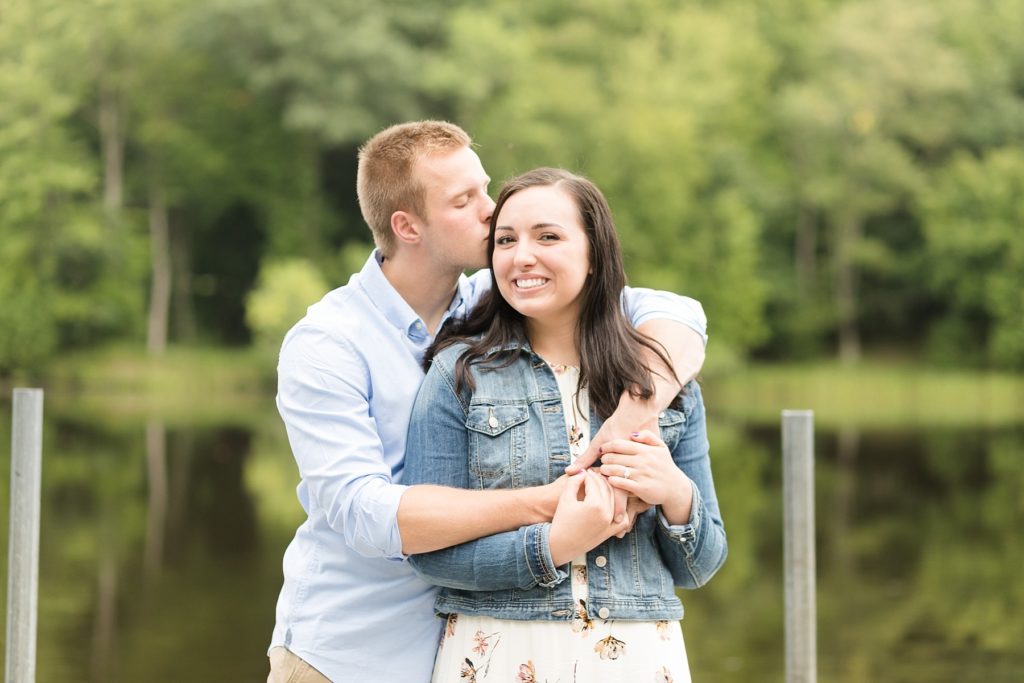 couple on a dock in Brunet Island State Park for their engagement pictures