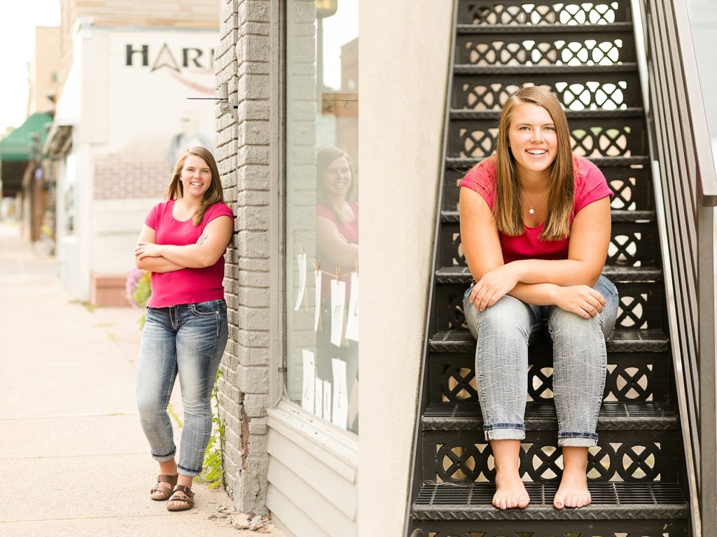 girl leaning on brick and sitting on black stairs in Chippewa Falls for her senior photos 