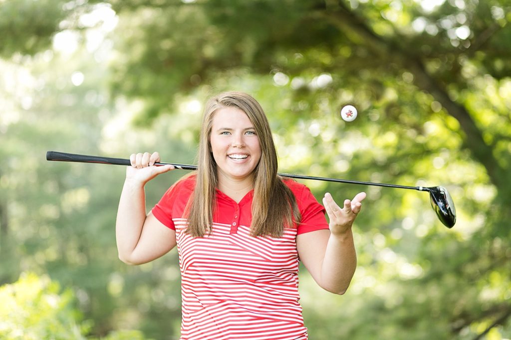 girl golf senior photo with girl tossing golf ball for the chi-hi girls golf team in Chippewa Falls, WI