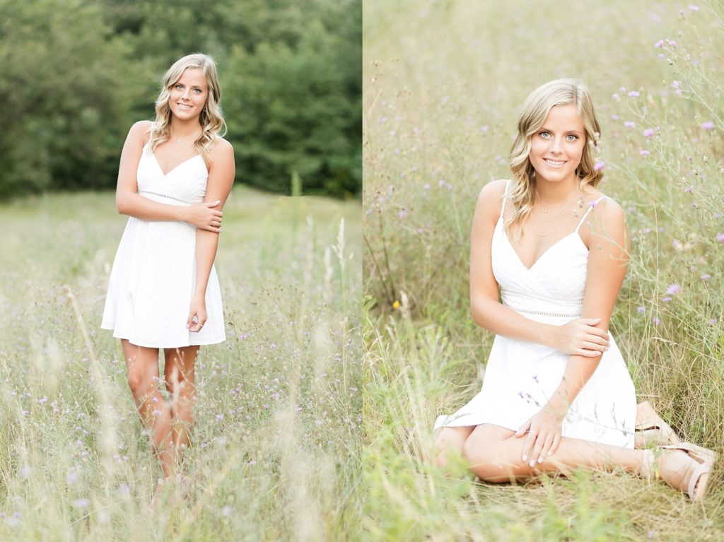 girl standing and sitting in a field of purple flowers in Chippewa Falls for her senior photos