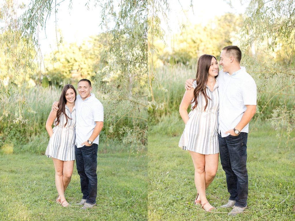 couple under a willow tree hugging for their anniversary and pregnancy announcement session