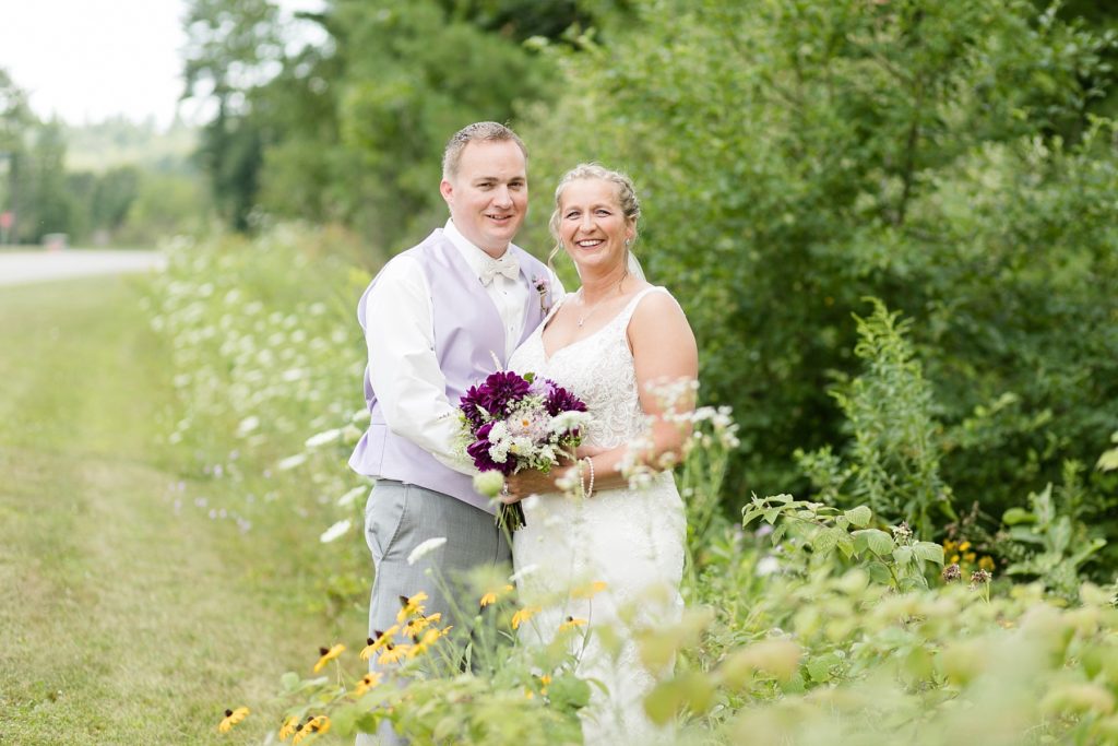 couple in flowers for their wedding at Three Bears Resort in Warrens, WI