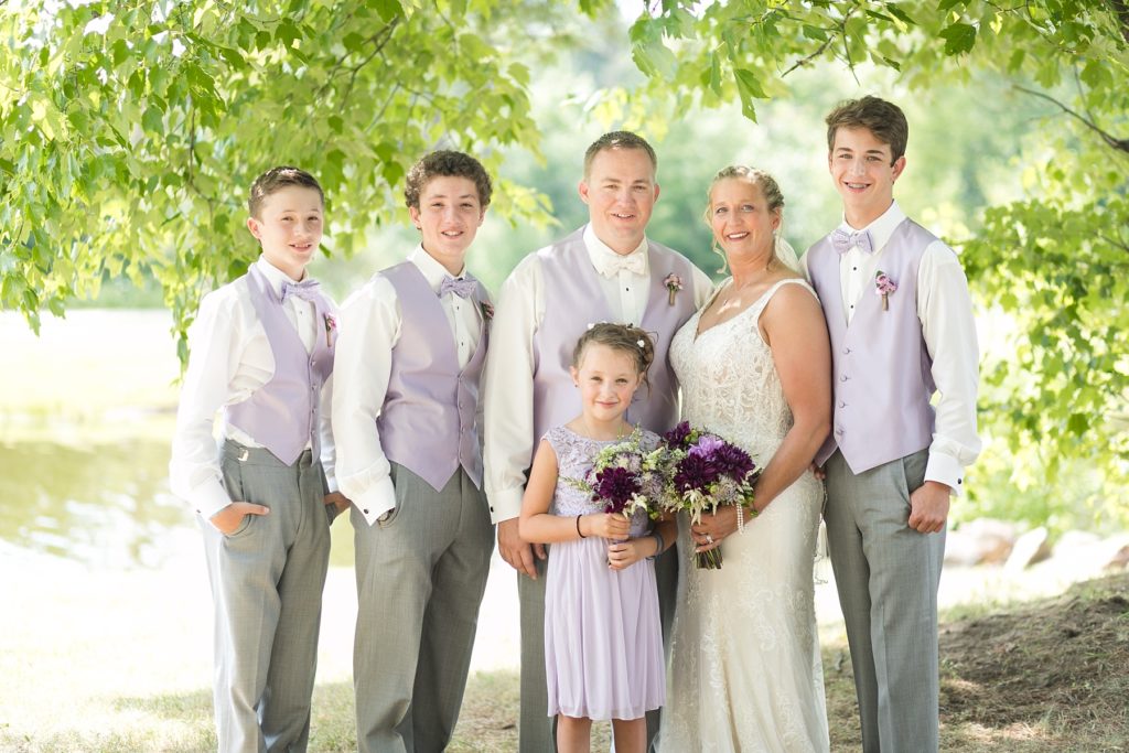 family portrait with purple and white for their wedding at Three Bears Resort in Warrens, WI