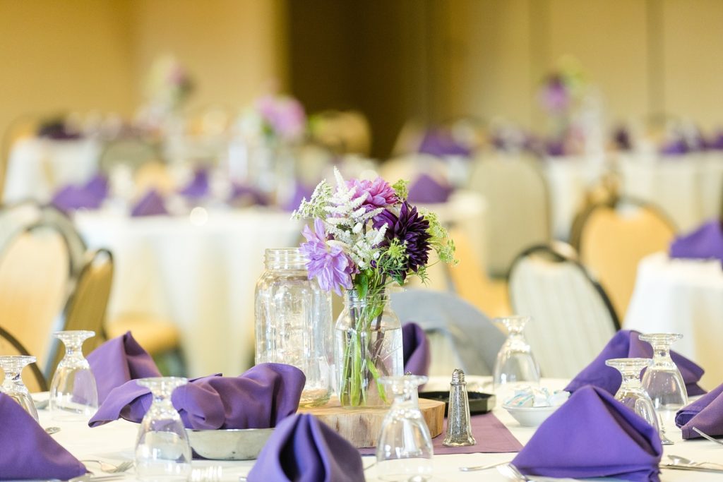 centerpieces and napkins in purple by Allure Premiere Event Florists at the Three Bears Resort in Warrens
