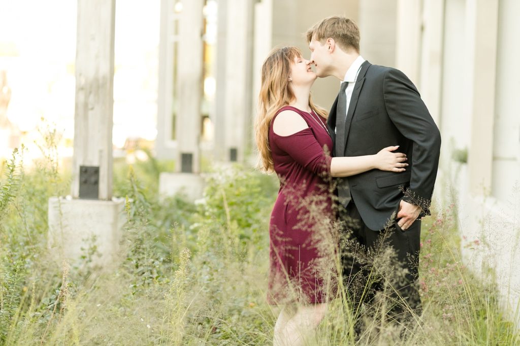 couple kissing in downtown Eau Claire for their engagement session