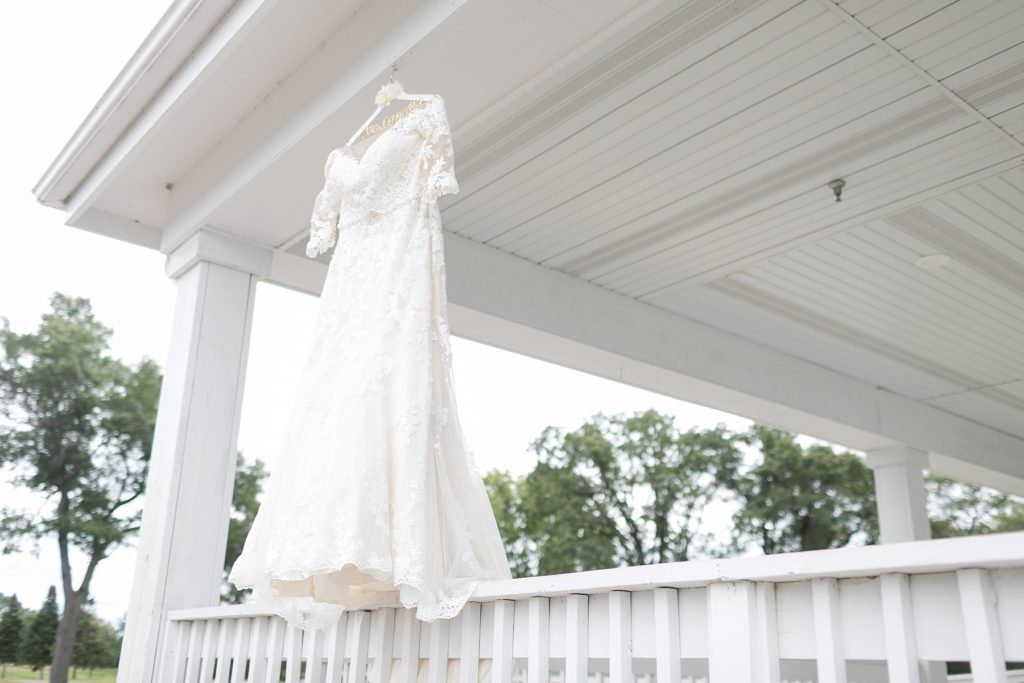 wedding dress hanging from the deck at Lake Wissota Golf & Events