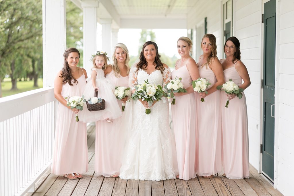 bride and bridesmaids in a blush wedding at Lake Wissota Golf & Events