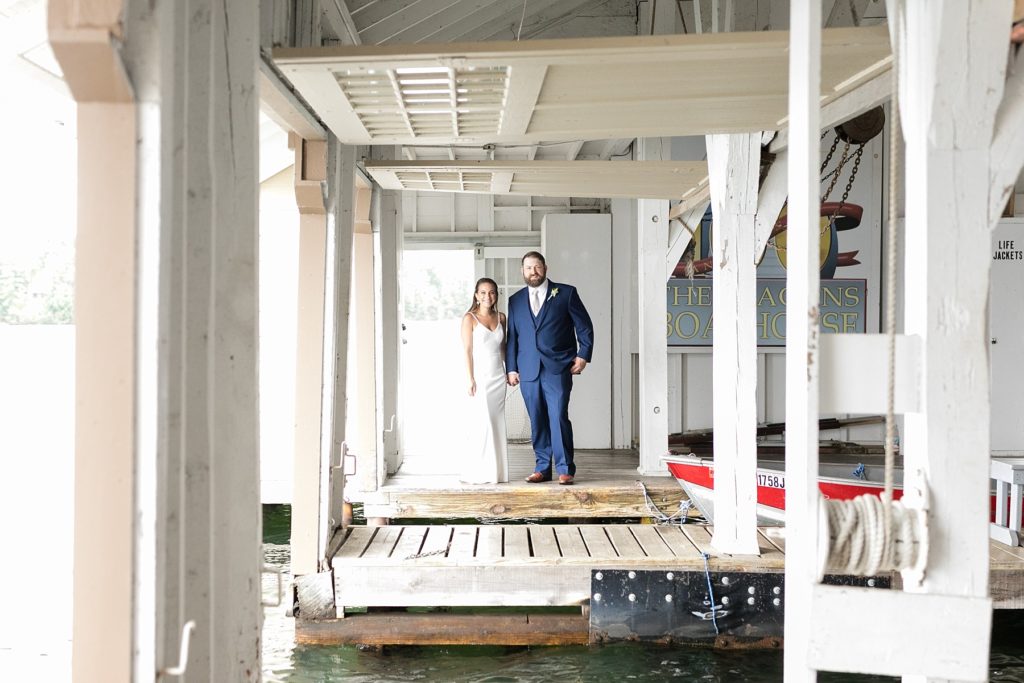 bride and groom in a boathouse at The Beacons of Minocqua on their wedding day